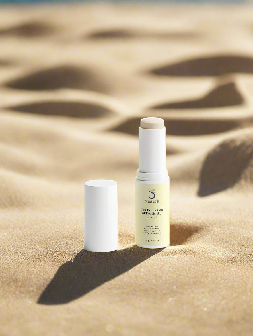 Eclat Soin SPF50 Sun Protection Stick without Tint on sandy beach for easy sun protection